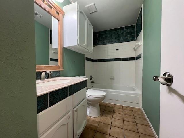 bathroom featuring shower / washtub combination, toilet, vanity, baseboards, and tile patterned floors