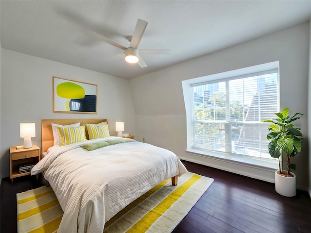 bedroom featuring dark wood-type flooring and ceiling fan