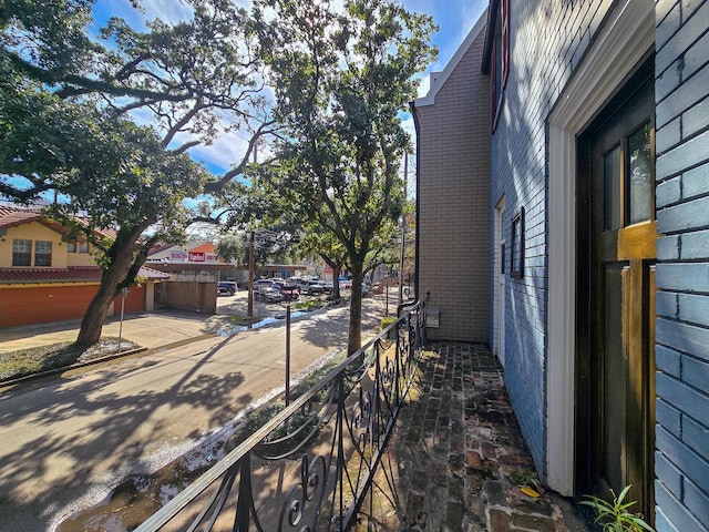 view of side of home featuring brick siding