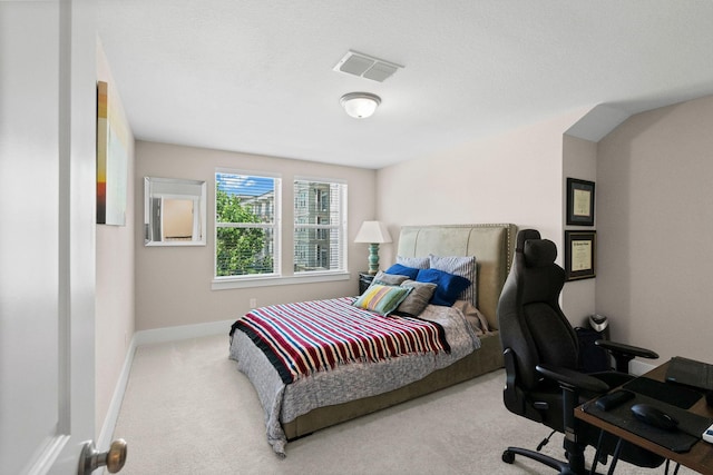 bedroom featuring carpet floors, visible vents, and baseboards