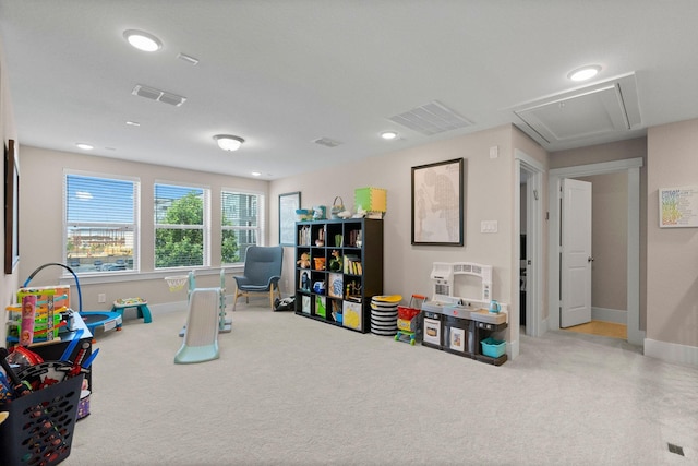 playroom with baseboards, visible vents, and carpet flooring