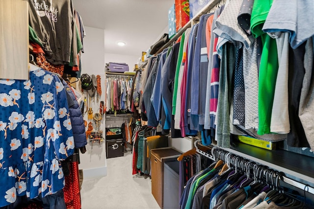 walk in closet with carpet floors