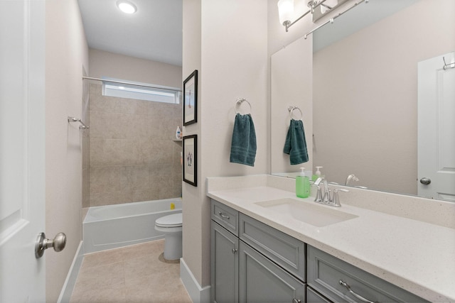 full bath featuring toilet, washtub / shower combination, vanity, tile patterned flooring, and baseboards