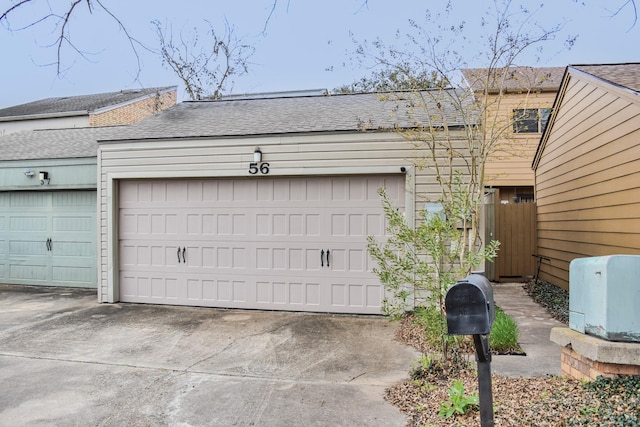 garage featuring driveway