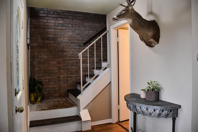 stairway with wood finished floors