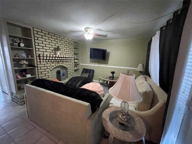 tiled living room featuring built in features and a ceiling fan