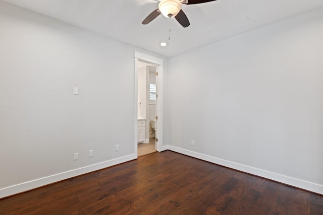 spare room with a ceiling fan, baseboards, dark wood-type flooring, and recessed lighting