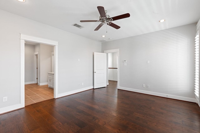 unfurnished bedroom with recessed lighting, visible vents, baseboards, dark wood-style floors, and ensuite bath