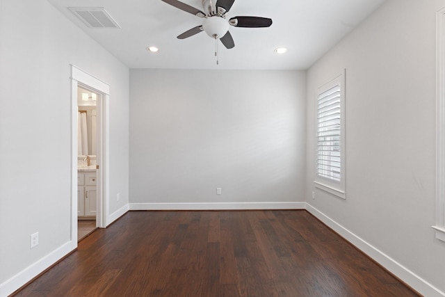 unfurnished room featuring baseboards, visible vents, dark wood-style floors, ceiling fan, and recessed lighting