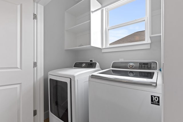 laundry area featuring laundry area and washer and clothes dryer