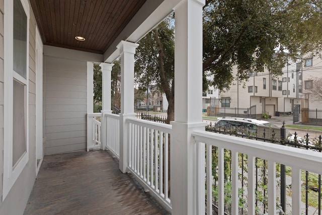 balcony with covered porch and a residential view