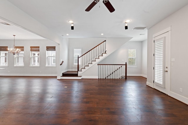 interior space with stairs, wood finished floors, visible vents, and baseboards