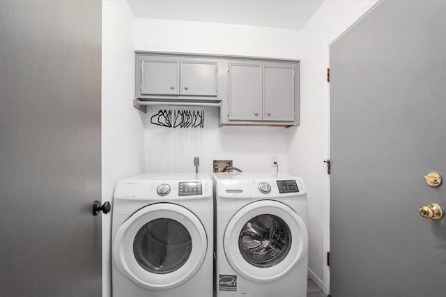 laundry area with cabinet space and washing machine and dryer