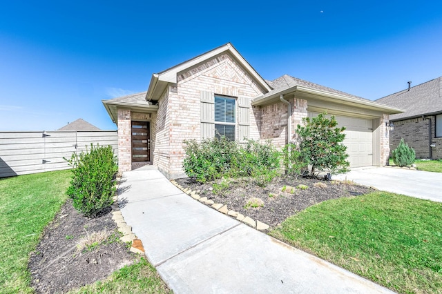 view of front of property featuring an attached garage, brick siding, driveway, roof with shingles, and a front yard