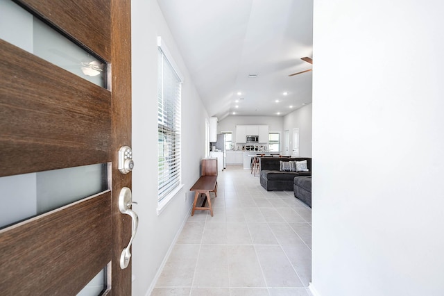 hall with recessed lighting, baseboards, and light tile patterned floors