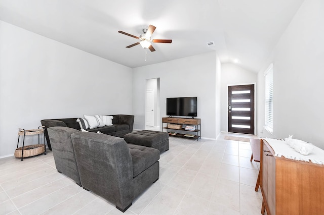 living room with a ceiling fan, lofted ceiling, visible vents, and baseboards