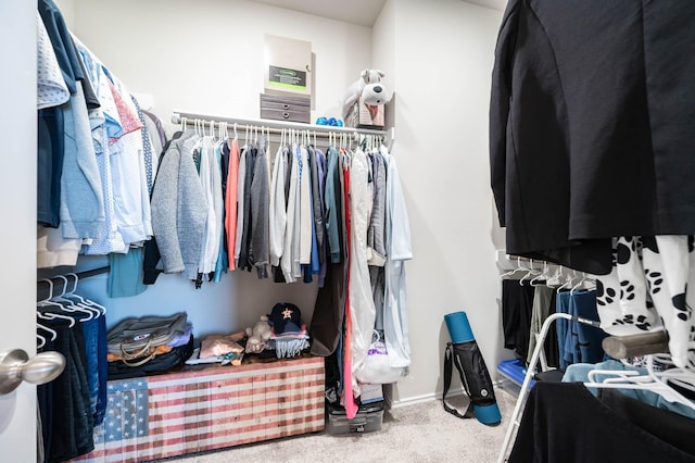 walk in closet featuring carpet