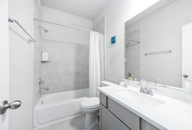 bathroom with shower / tub combo, vanity, and toilet