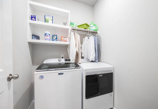 laundry room with laundry area and washing machine and dryer