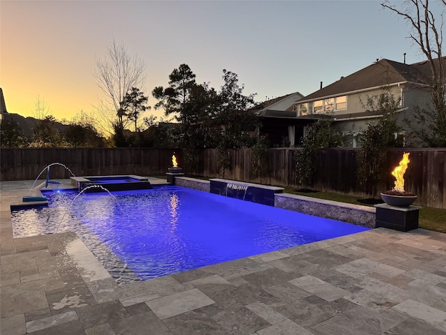 view of pool with a fenced in pool, a fenced backyard, a patio, and an in ground hot tub