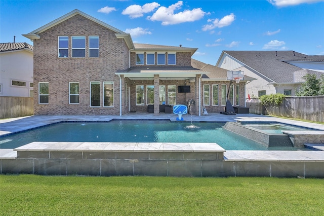 view of pool featuring a yard, a patio area, and a fenced backyard