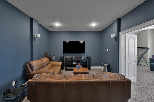 living area featuring baseboards, visible vents, and carpet flooring