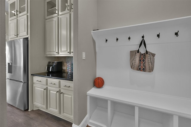 mudroom with dark wood finished floors