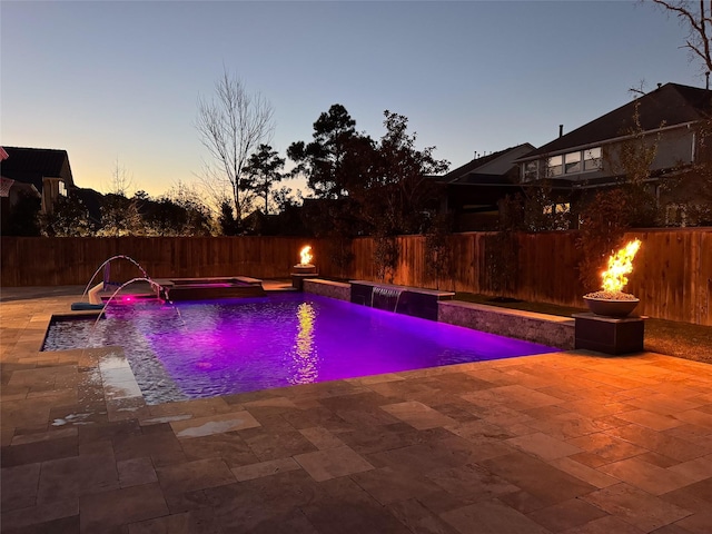 view of pool featuring a jacuzzi, a fenced in pool, a fenced backyard, and a patio