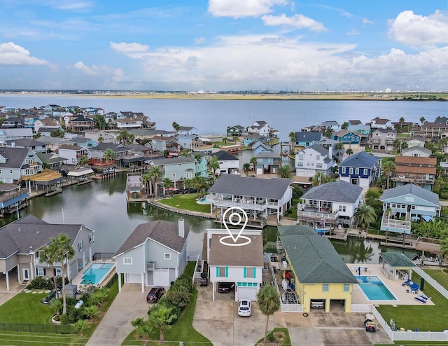 bird's eye view featuring a residential view and a water view