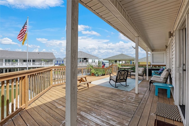 wooden terrace featuring a residential view