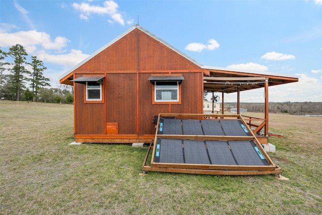 view of outbuilding with solar panels