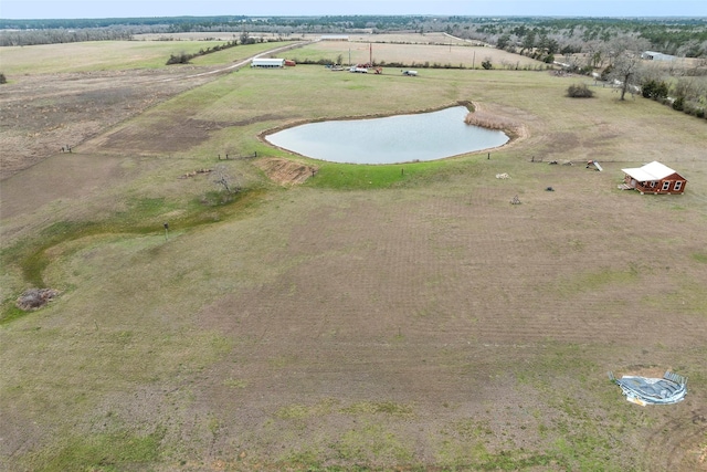 birds eye view of property with a rural view and a water view