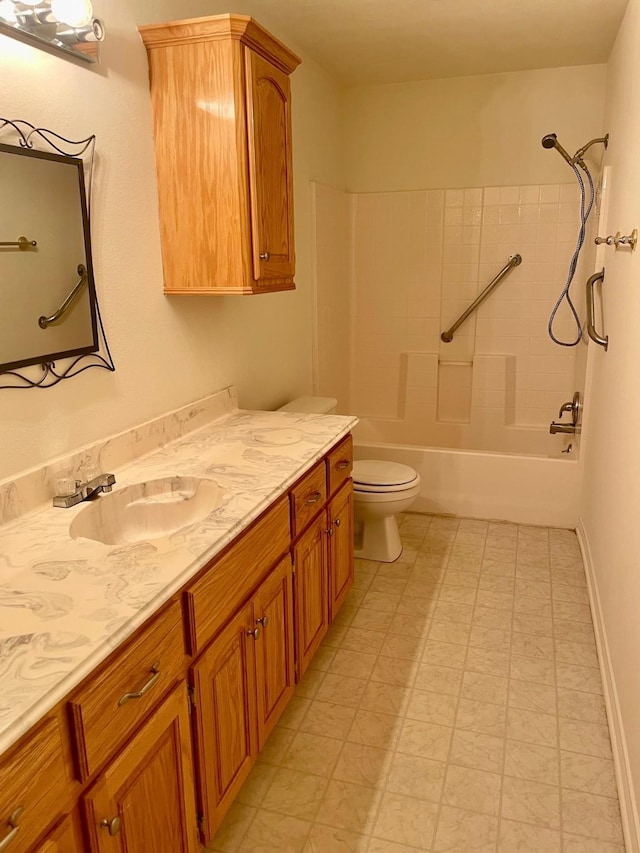 bathroom featuring baseboards, toilet, tile patterned floors, vanity, and shower / washtub combination