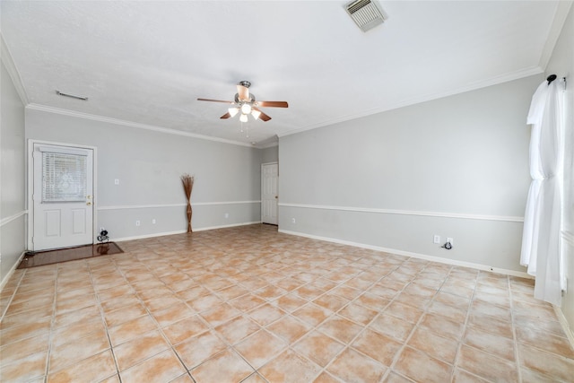 empty room with crown molding, baseboards, visible vents, and a ceiling fan