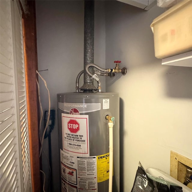 utility room featuring gas water heater