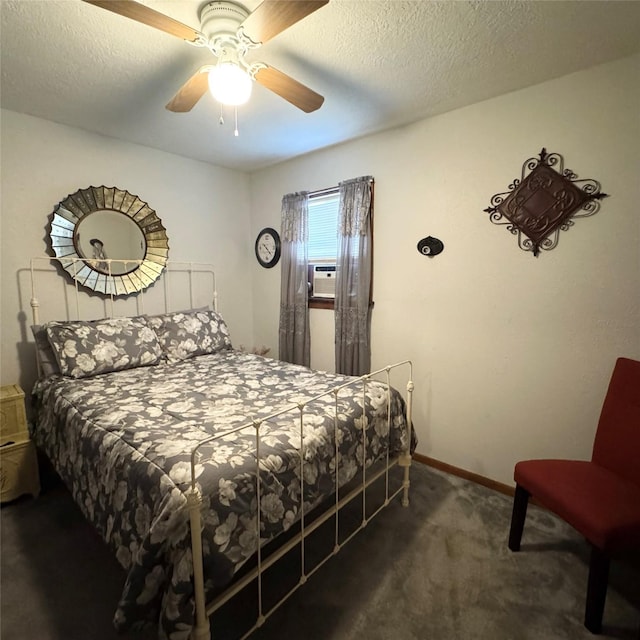 bedroom with dark carpet, ceiling fan, a textured ceiling, cooling unit, and baseboards