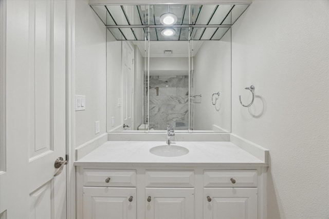 full bathroom with vanity and a shower stall