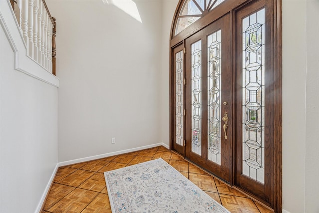 foyer entrance with baseboards