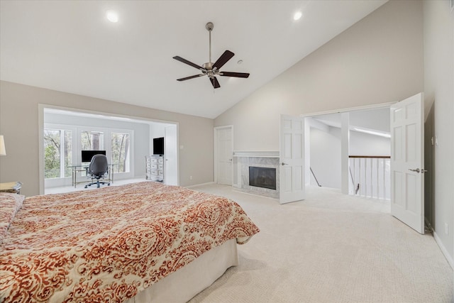 bedroom featuring high vaulted ceiling, a premium fireplace, carpet, and baseboards