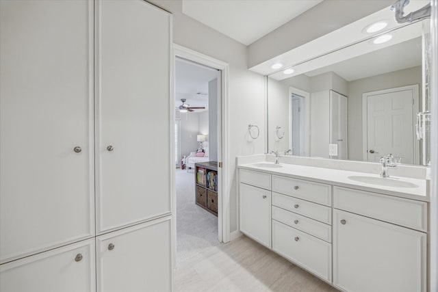 full bathroom with double vanity, recessed lighting, a sink, and ensuite bathroom