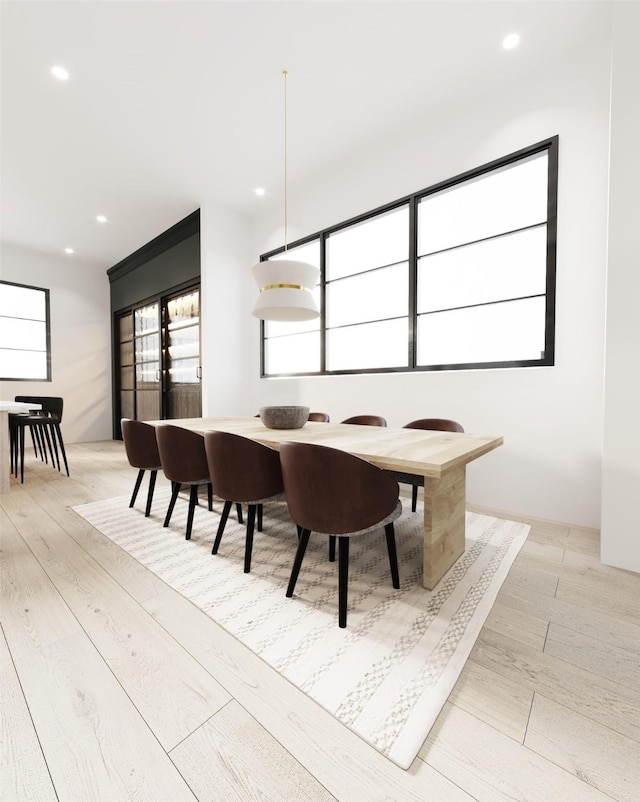 dining room featuring light wood-type flooring and recessed lighting