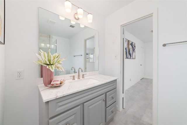 bathroom featuring visible vents and vanity