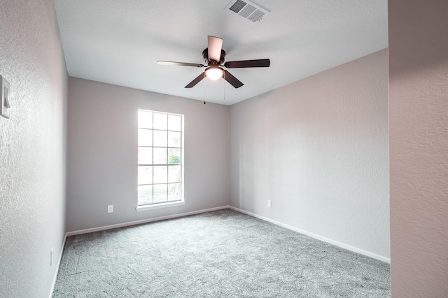 20650 S Hillcrest Dr, Porter, TX 77365 - carpeted empty room featuring a textured wall, ceiling fan, and baseboards