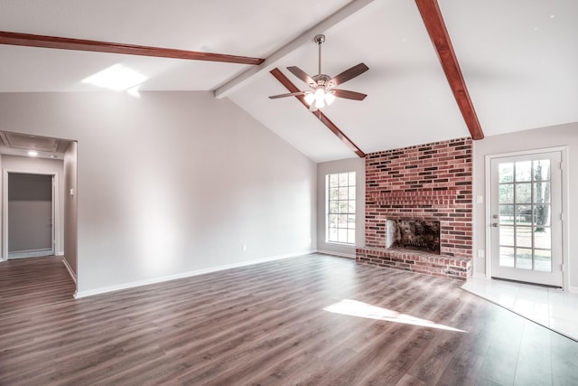 20650 S Hillcrest Dr, Porter, TX 77365 - unfurnished living room with a ceiling fan, wood finished floors, attic access, beam ceiling, and healthy amount of natural light
