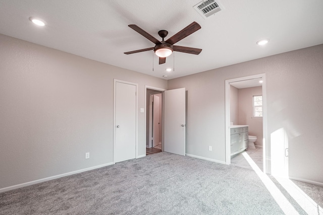 20650 S Hillcrest Dr, Porter, TX 77365 - unfurnished bedroom featuring ensuite bathroom, recessed lighting, baseboards, light colored carpet, and ceiling fan