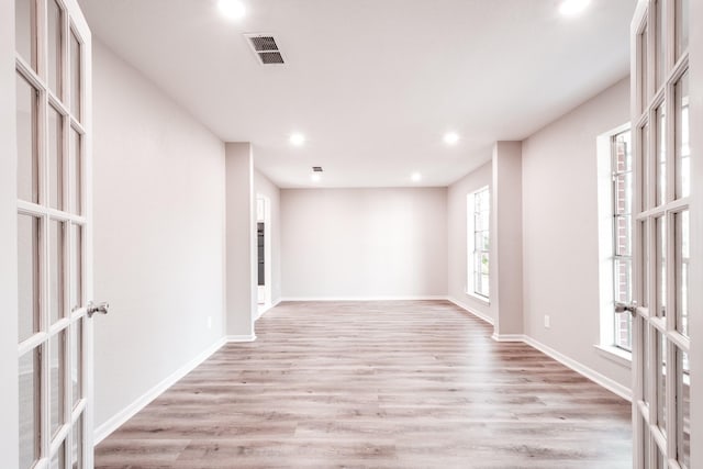 20650 S Hillcrest Dr, Porter, TX 77365 - unfurnished room featuring french doors, recessed lighting, light wood finished floors, and baseboards