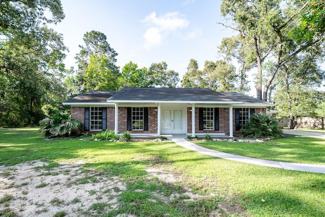 20650 S Hillcrest Dr, Porter, TX 77365 - ranch-style house with a front lawn, brick siding, and a porch