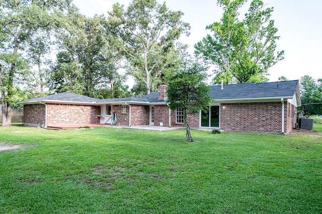 20650 S Hillcrest Dr, Porter, TX 77365 - rear view of property with brick siding, a patio area, a chimney, and a lawn