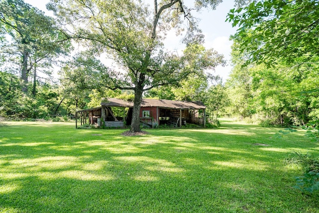 20650 S Hillcrest Dr, Porter, TX 77365 - view of grassy yard featuring an outdoor structure and an outbuilding