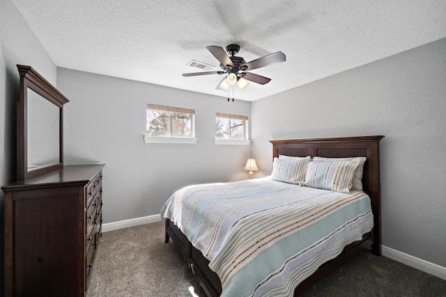 bedroom featuring carpet floors, a textured ceiling, baseboards, and a ceiling fan